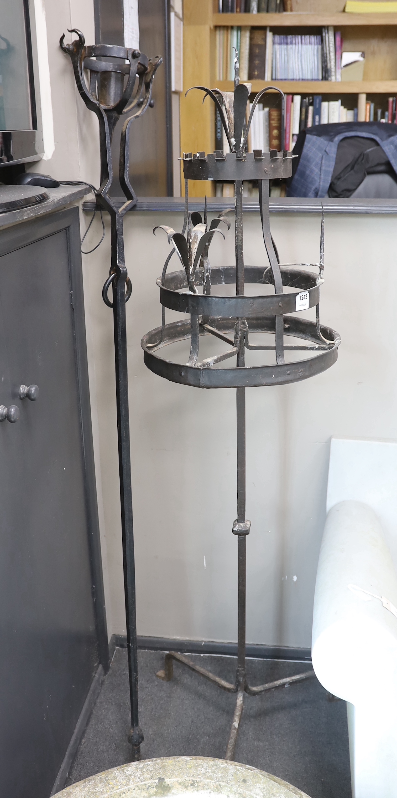 A wrought iron pricket candelstand, in 17th century style, height 172cm, together with a gimbaled wrought iron candle branch (2), Provenance- Brede Place, East Sussex, a former residence of the Frewen family from 1712-19